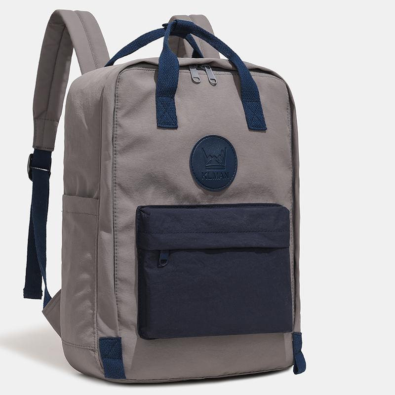 Farbblock-Rucksack mit Fronttasche und gepolsterten Schultergurten