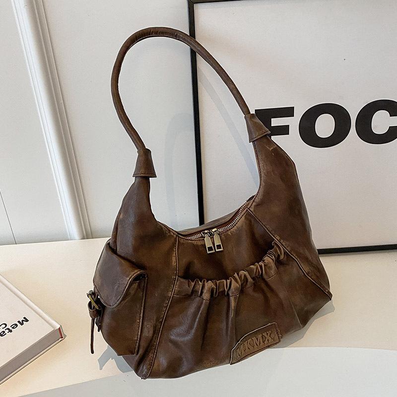 Niche high-end sense retro Spice Girl underarm bag women 2025 new Maillard style shoulder bag pleated dumpling bag