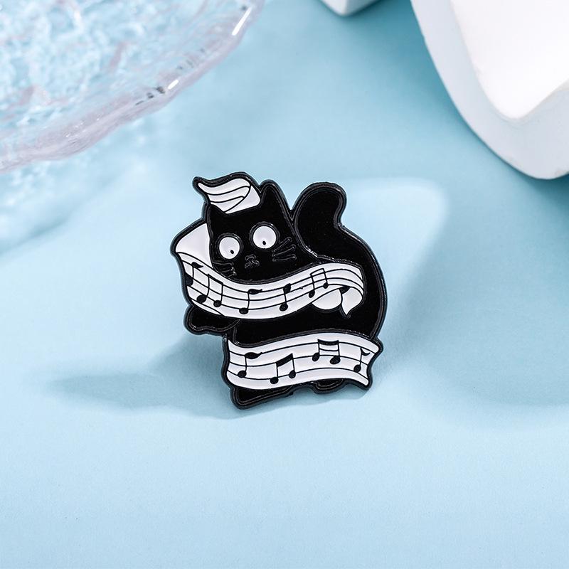 Creative Black Cat Keyboard Brooch: Cartoon Cat Playing Music with Wagging Tail