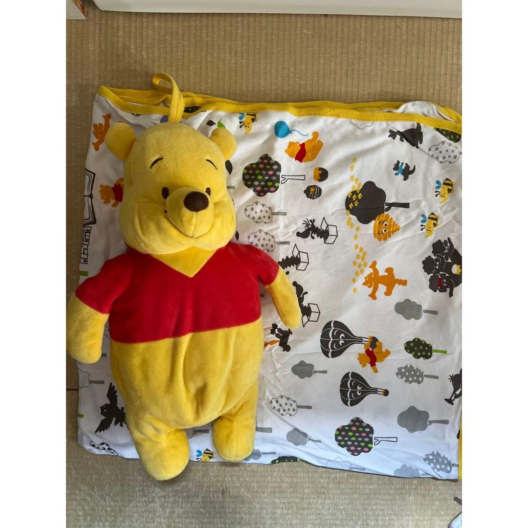 Pooh stuffed animal with blanket
