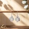 Explosive hollow flower enamel color earrings European and American style line winding earrings commuting versatile light luxury earrings