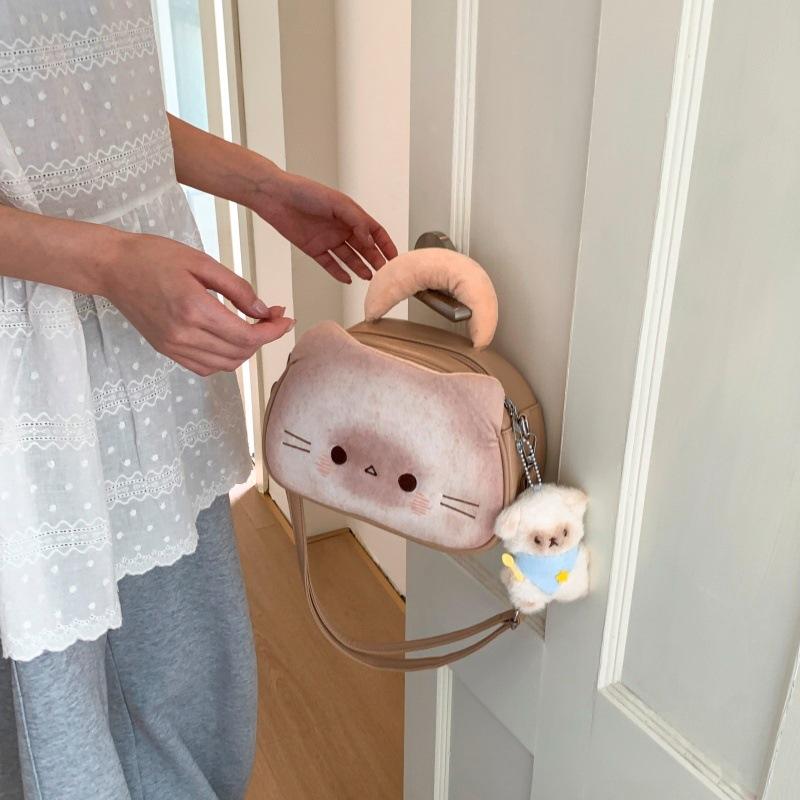 Internet celebrity cute biscuits kitten bag 2025 new Japanese cartoon girl foreign versatile messenger small round bag tide