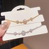 Koreanischer Stil Zirkonia Rundes Durchbrucharmband: Elegantes, hochwertiges, vielseitiges Design für Handschmuck.