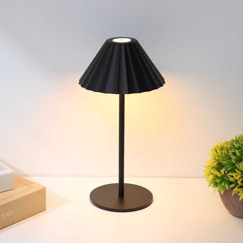 

Robin (Black) is a stylish, cordless, Nordic-inspired table lamp with touch-sensitive indirect lighting, perfect for bedside or bedroom use. It