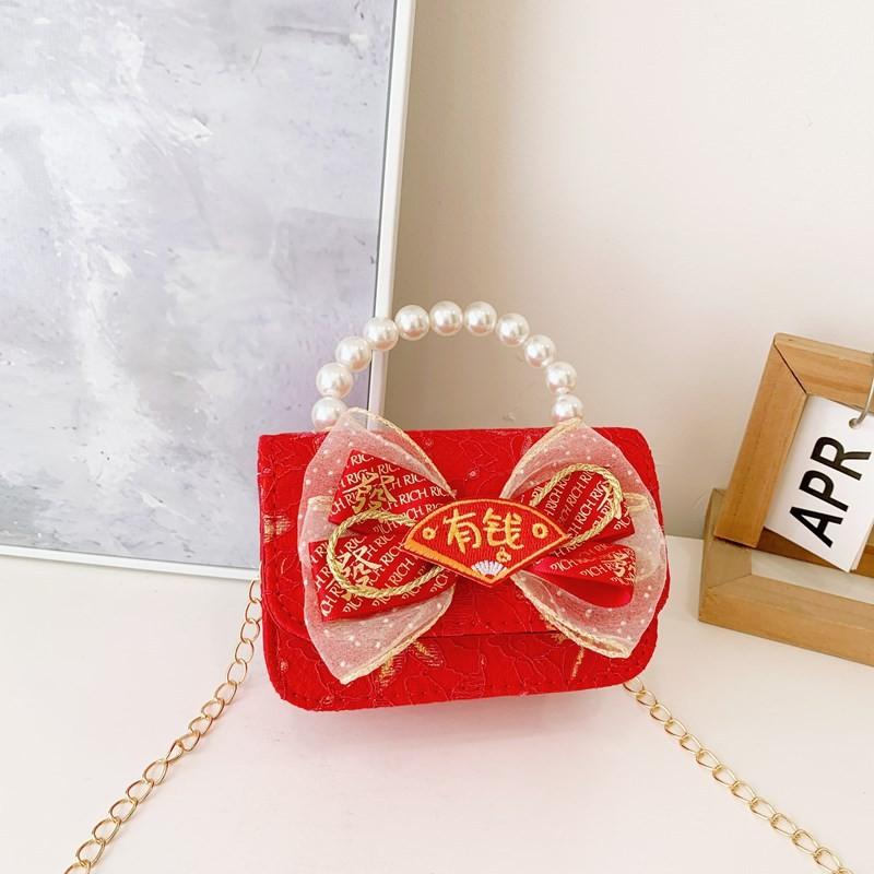 Red Adorable Pu Handbag For Kids Featuring Bow Design And Trendy Strap Chain