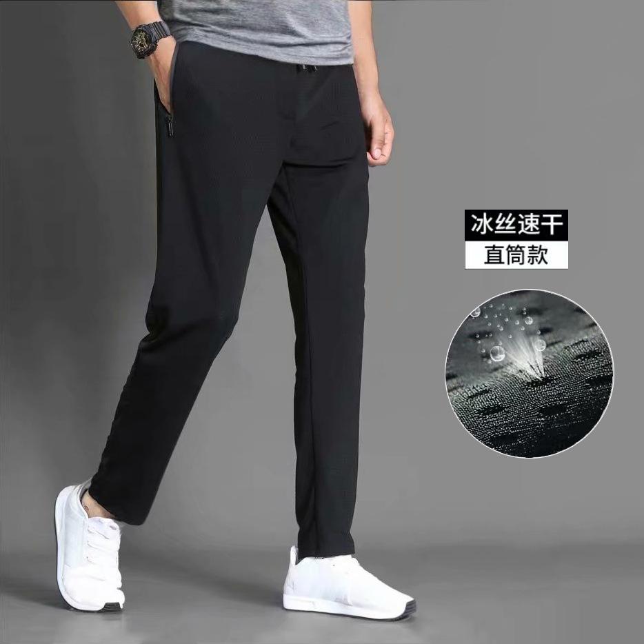 

Air conditioning cloth mesh nine-point pants men s slim-fitting small feet closed feet hollowed out black trendy sports long pants 5XL