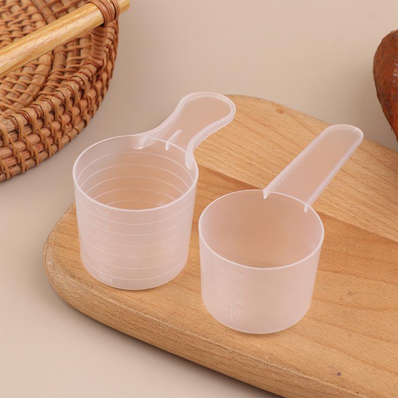 10 ks 15/25/30/35g Průhledná plastová lžička na sušené mléko s odměrkou v ml Kuchyňská pečicí odměrka