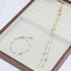 Elegant 18K Gold Beaded Necklace & Flower Bracelet in Titanium Steel