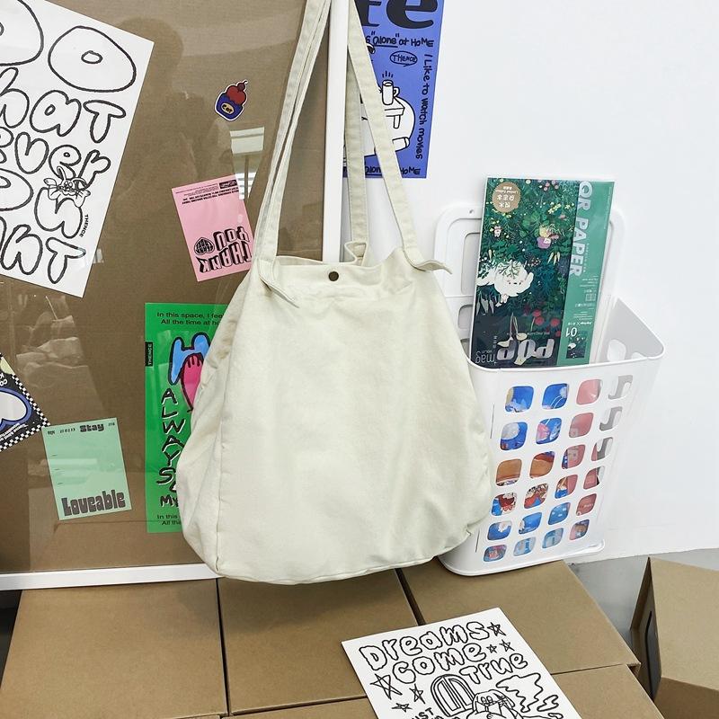 

Japanese lazy style literary and artistic large-capacity canvas bag female solid color simple versatile shopping bag student class shoulder bag