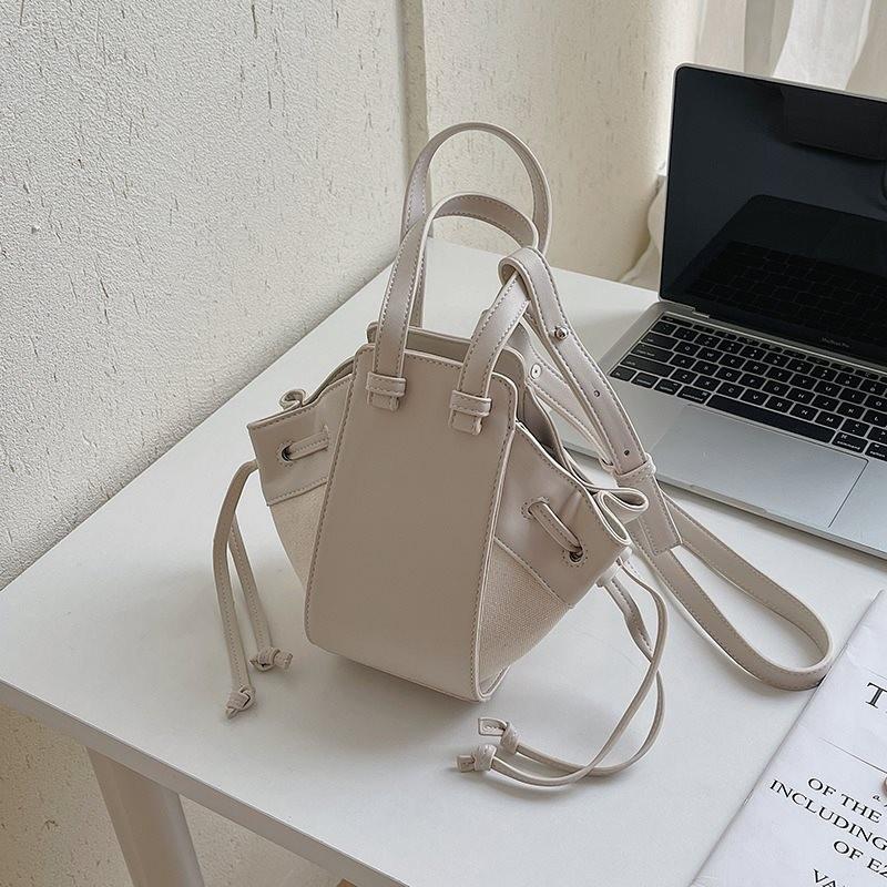 

Versatile Stylish Bucket Bag With Unique Patchwork And Durable Polyester Lining