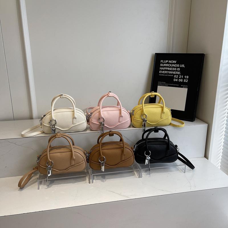 New textured portable bowling bag women's 2025 spring fashion simple shoulder messenger bag popular small square bag