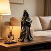 Tabletop Resin Sculpture with Hooded Character, Open Spell Book, and Bronze Style Finish for Shelf Display Use