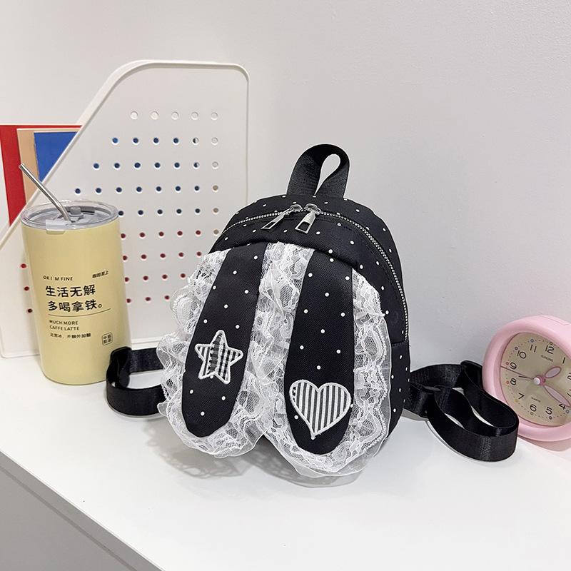 Schoolbag Korean version of sweet girl polka dot lace backpack new lop-eared rabbit trend high value travel foreign style backpack