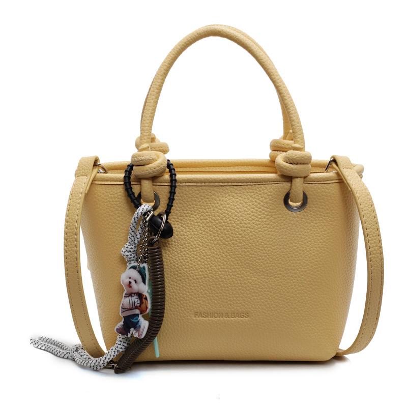 

Hot-selling lychee pattern texture simple portable bucket bag Korean version casual temperament versatile commuter style messenger women s bag жёлтый