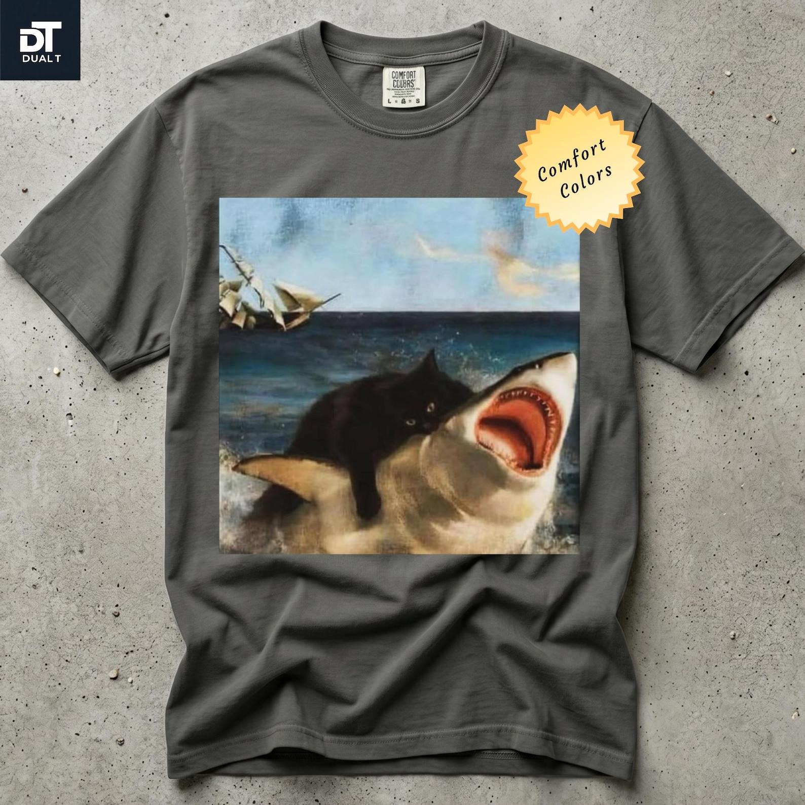 Comfort Colors Black Cat Biting Shark Unisex Graphic T-Shirt | Funny Renaissance Art Graphic Tee | Absurd Vintage Animal Meme T-Shirt XL