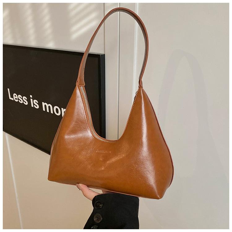 

Нишевый дизайн сумка подмышку женская весна 2025 текстурная сумка-пельмень популярна в этом году, одноплечная сумка-подмышка для поездок на работу темно-коричневого