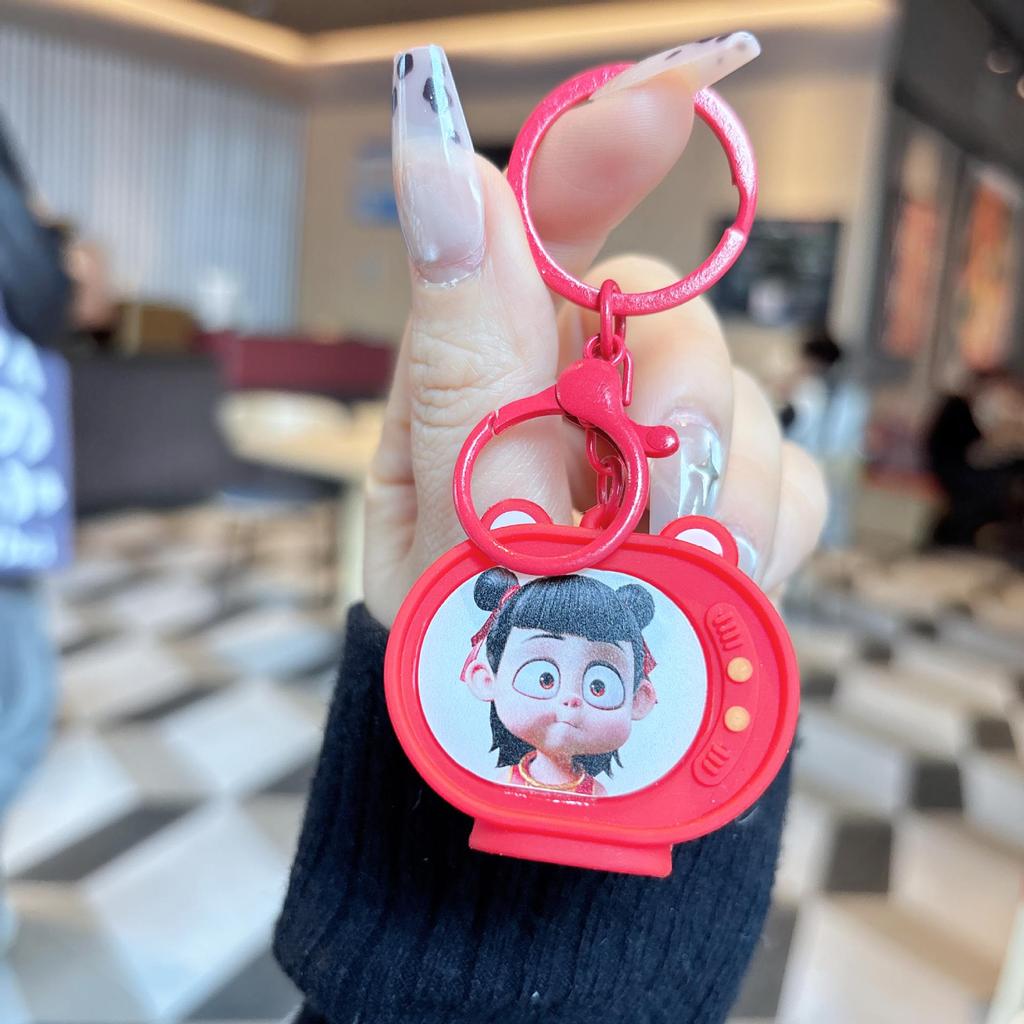 Nezha Luminous TV Keychain with Light - Student Backpack Pendant Ornament.