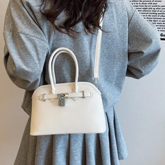 2025 new women's lychee pattern solid color lock shoulder bag temperament niche versatile commuter portable messenger