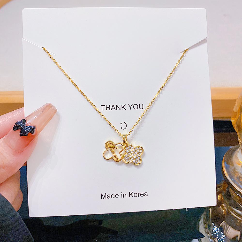 High-End Titanium Steel Clavicle Chain with Zircon Inlaid Four-Leaf Clover Pendant Necklace
