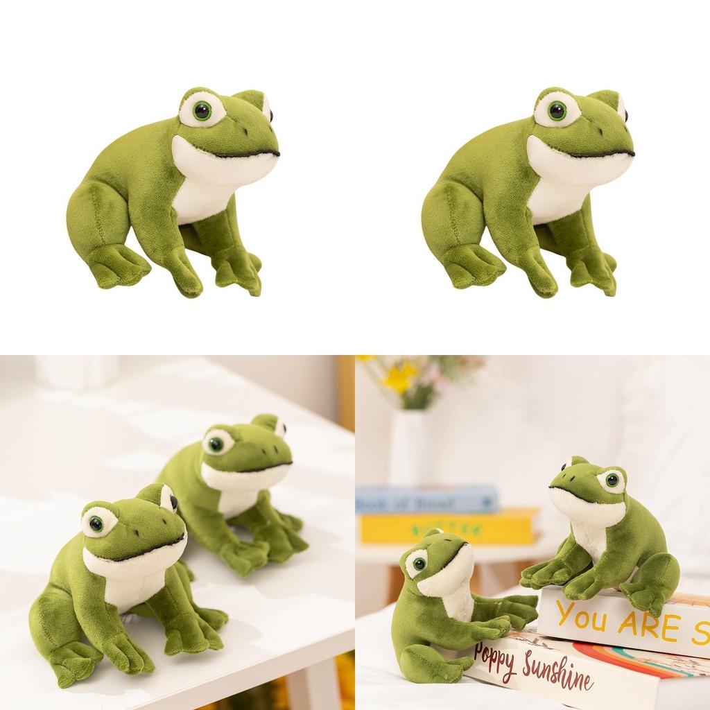 Pluche kikker in zittende positie met grote ogen, ideaal als cadeau en decoratie voor kinderen.