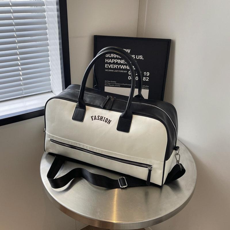 

PU waterproof short-distance travel bag, women s shoulder portable travel, business trip luggage bag, boarding travel bag, men s light travel чорний