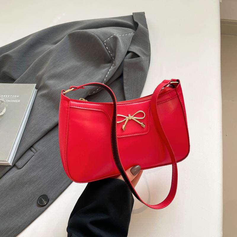 Fashion bow 2025 solid color new Korean version trendy texture foreign style commuting single shoulder underarm baguette bag women