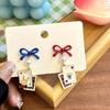 Asymmetrical Poker Rabbit Bowknot Earrings with Silver Needle Stud and No-Pierce Clip.