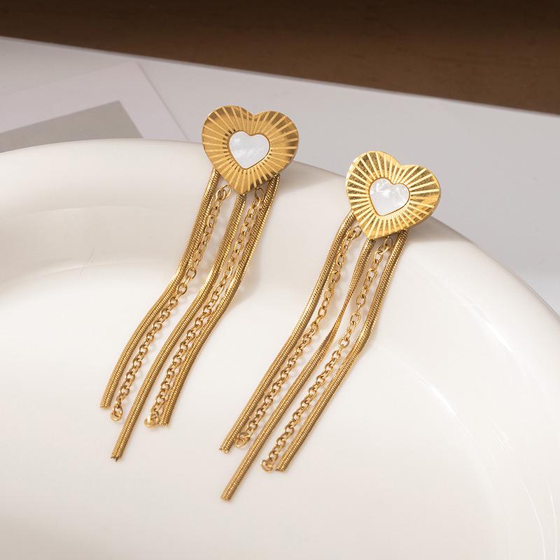 Geometric Hollow Heart Tassel Earrings: Titanium Steel Studs with Light Luxury Design.