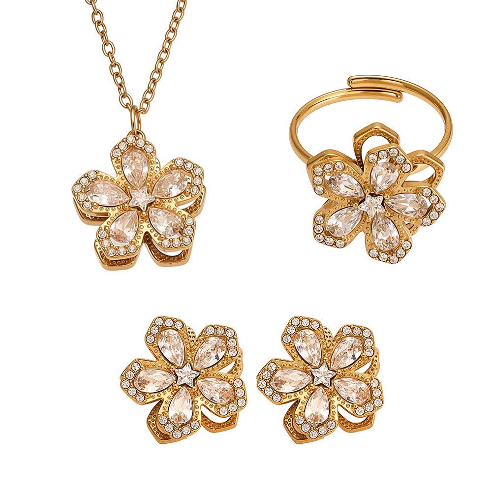 Oumika Oumei Five-Petal Zircon 360° Rotating Jewelry Set: 18K Gold-Plated Earrings, Ring, and Necklace.