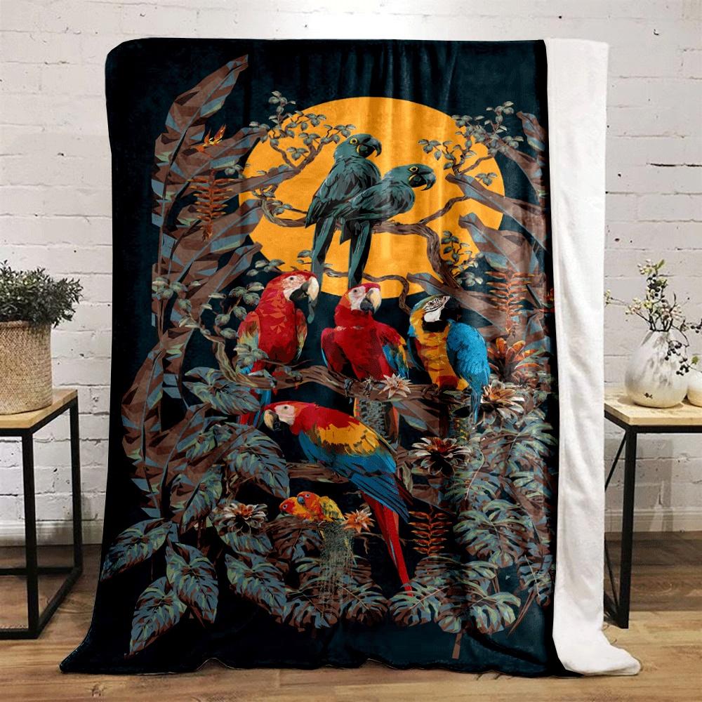 Colorful parrots perched on branches with tropical foliage and a sunset. for all seasons blanket lunch break throw gift