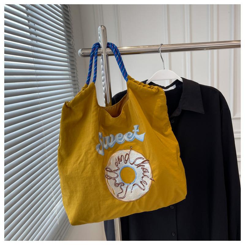 

Маленькая вышитая сверхлегкая тканевая сумка для женской сумки, тканевая сумка-пончик на одно плечо one size жёлтый