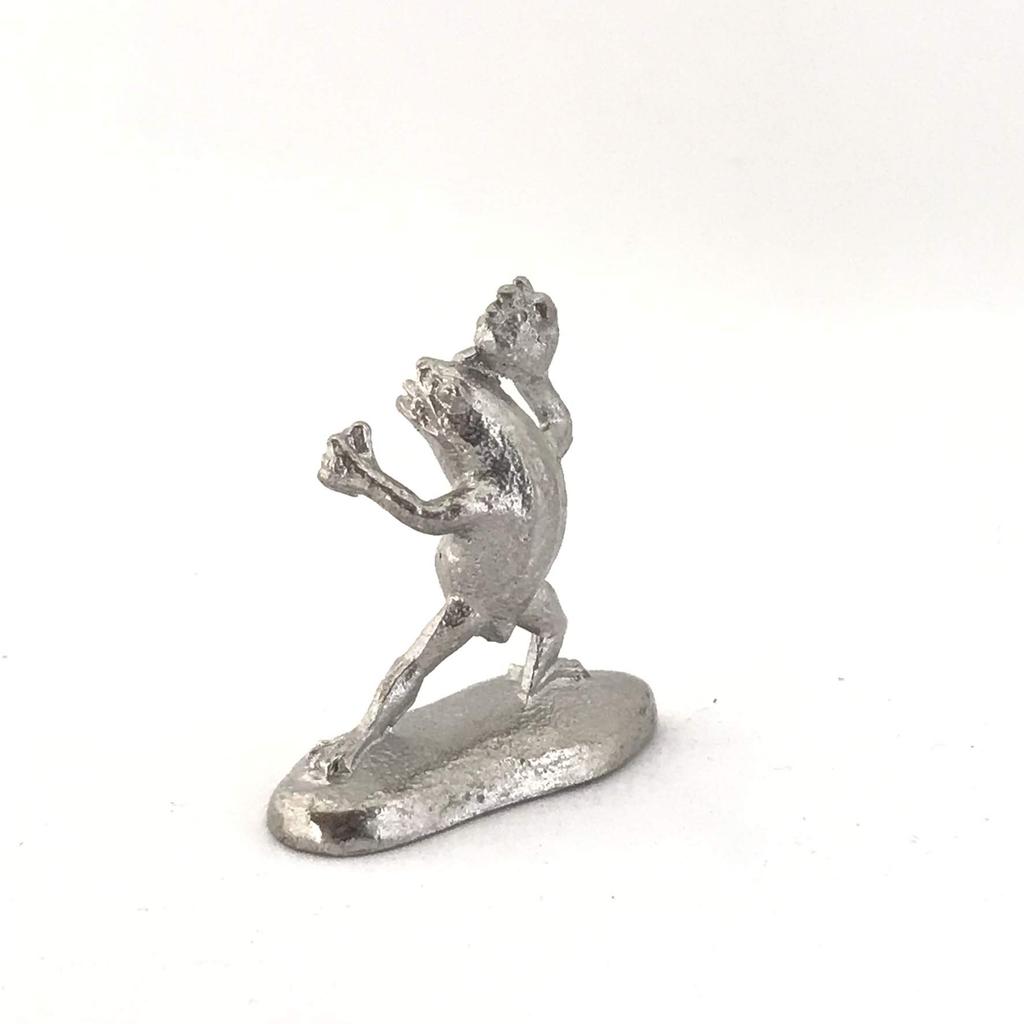 A miniature tin frog from the Choju Jinbutsu Giga perfect for your dry landscape painting, garden.
