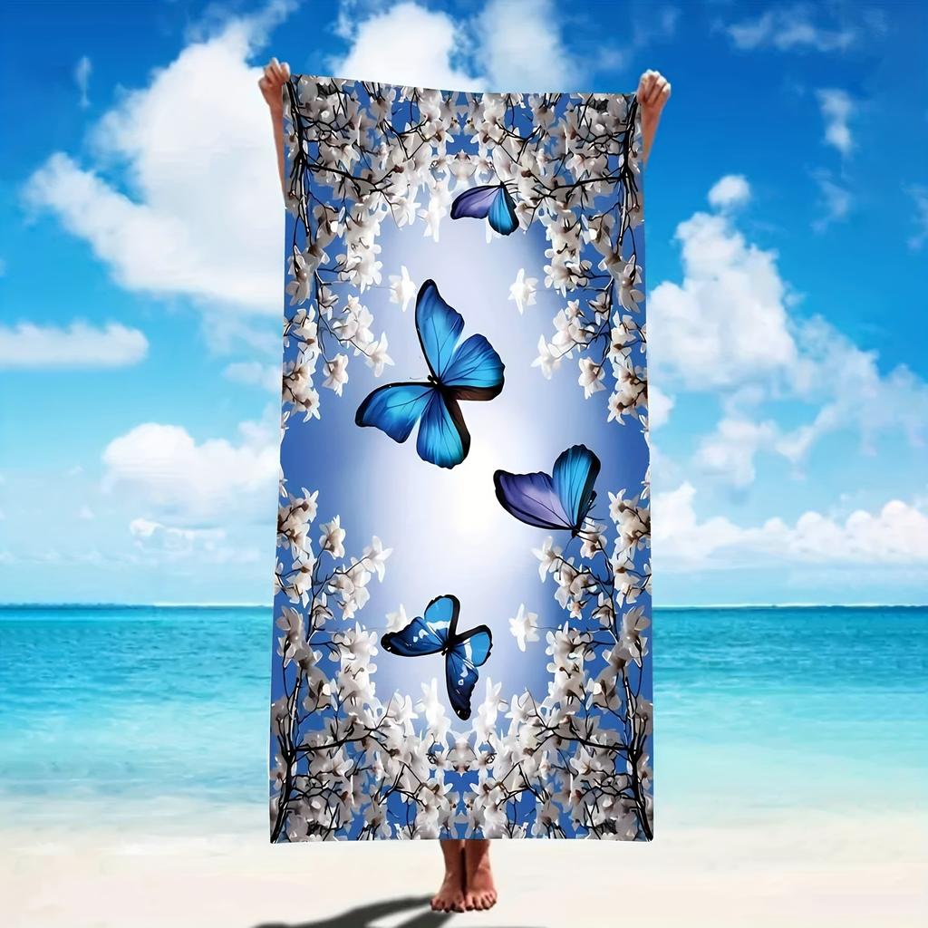 A women's oversized beach towel that is soft quick-drying and super absorbent with a beautiful butterfly and flower design