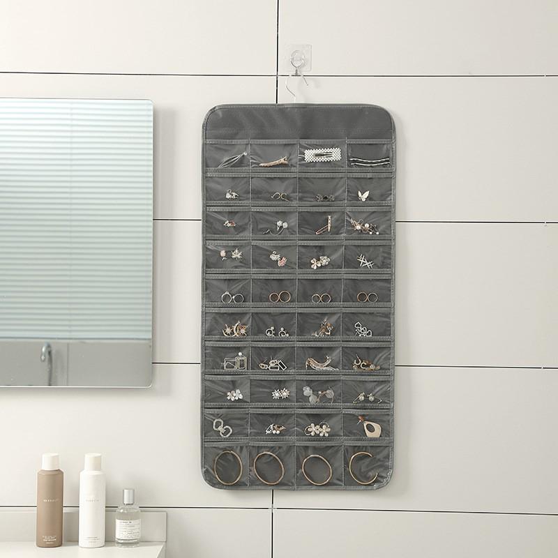 Double-Sided Non-Woven Jewelry Organizer: 80-Compartment Hanging Bag for Earrings and Small Items, Dustproof Storage Solution.