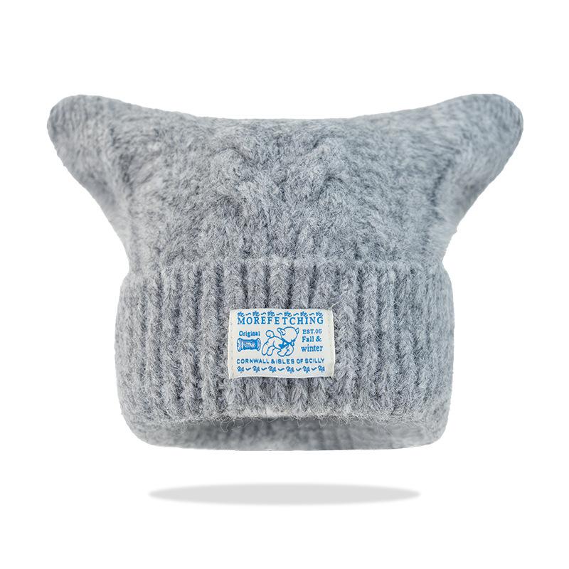 

Original new autumn and winter sweet knitted hat showing face small versatile pullover hat warm ear protector wool hat female spot сірий колір