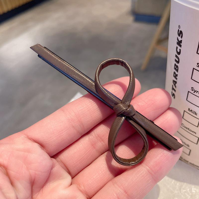 

Korean Faux Leather Bow Hair Clip: Cute, Sweet Accessory for Women and Girls