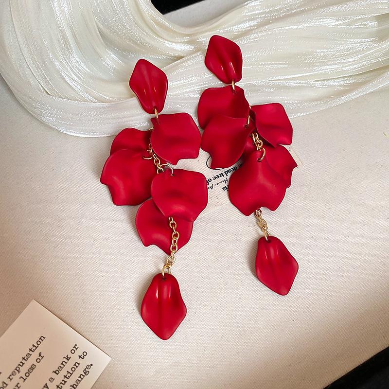 Boucles d'oreilles bohèmes roses à fleurs de perles de rocaille et pompons de perles