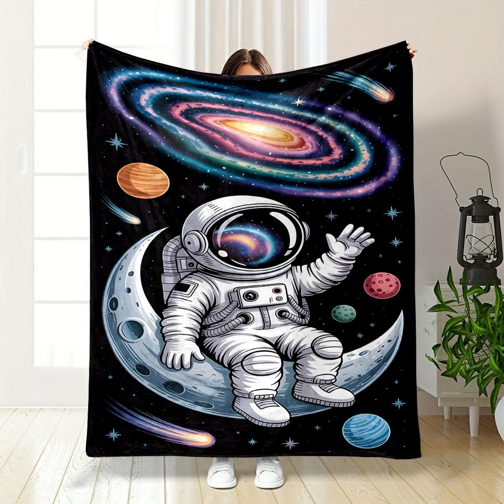 Astronaut Sitting on Moon in Space Patterned flannel blanket perfect for the bedroom living room, sofa, or a little nap