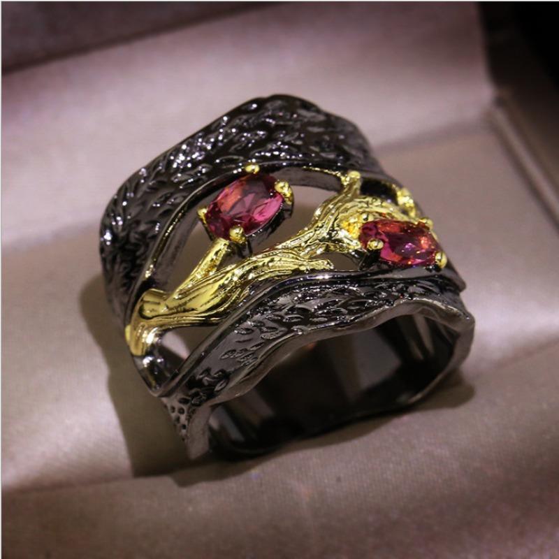Black and gold branch ring with inlaid accents. Unique art style for Halloween and Christmas—mysterious and fantastical.