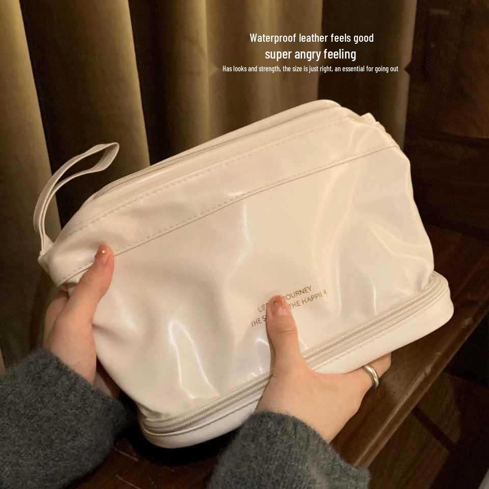 

Two-Layer Cloud Makeup Bag: Portable Travel Handbag for High-Capacity Toiletries and Cosmetics Storage Premium PU material