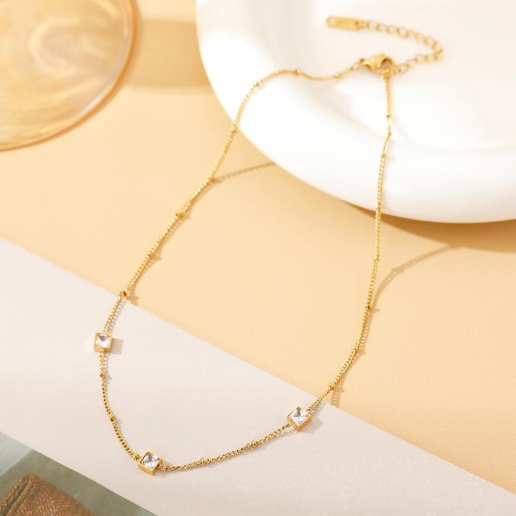 French Elegant White Zirconia Jewelry Set: Necklace, Bracelet & Earring Studs in Titanium Steel.