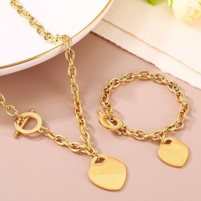 

Heart-Shaped Titanium Steel Bracelet with OT Buckle and English Letter Charm