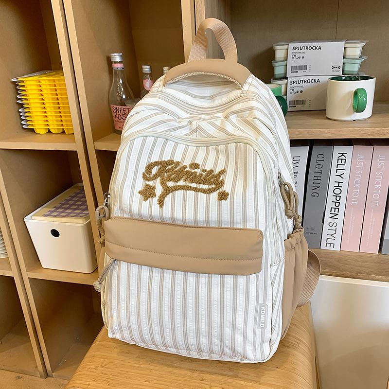 New high-value, fresh and sweet candy-colored striped backpack, high school student large-capacity backpack.