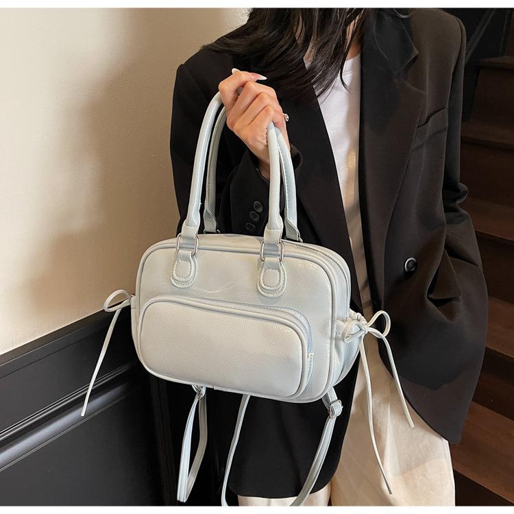 Niche design bag new fashion casual backpack women's hand retro shoulder pillow bag