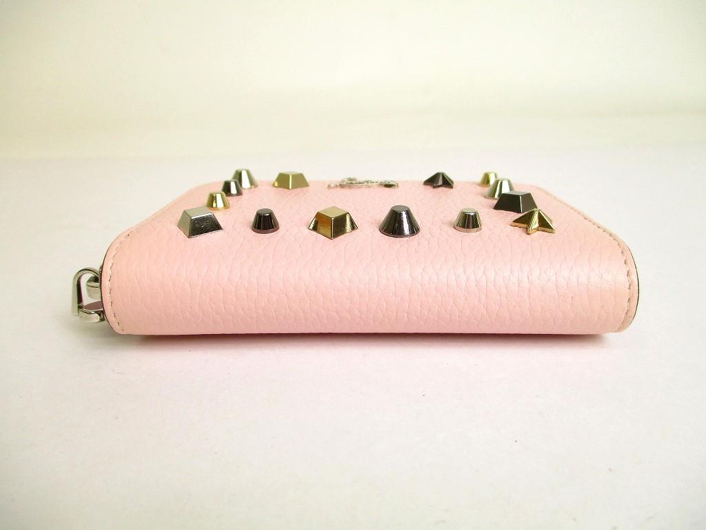 Porte-monnaie rond zippé en cuir rose clair Christian Louboutin authentique #9691 remis à neuf