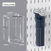 Pannello forato da parete senza foratura: Espositore personalizzabile con ganci e cestini per la casa o lo studio.