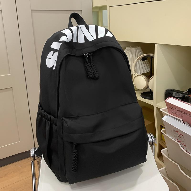 Hochwertiger modischer einfacher Buchstaben-Print lässiger Rucksack Schüler vielseitig große Kapazität Pendlerrucksack