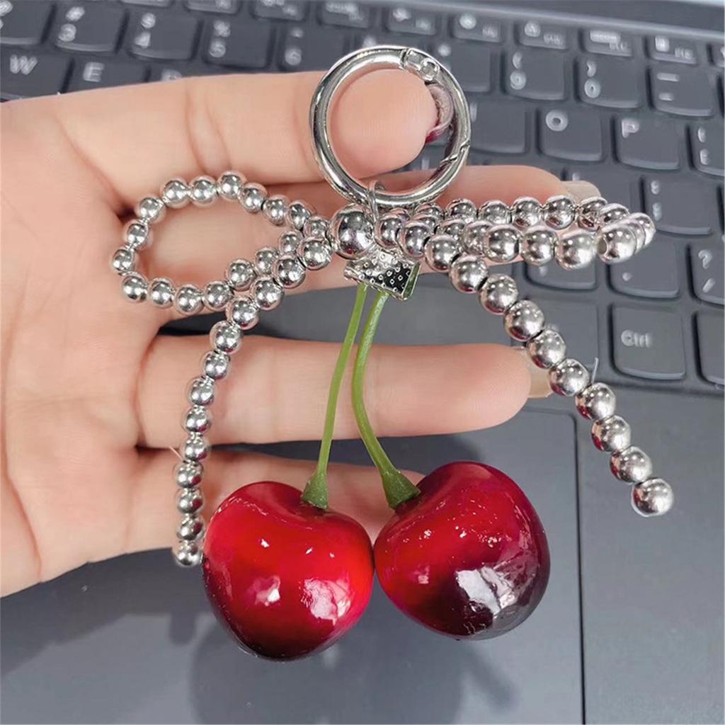 Cherry Pendant Keychain With Bowknot Fashionable Cherry Keychain with Pearlescent Bowknot Accents for Trendsetters