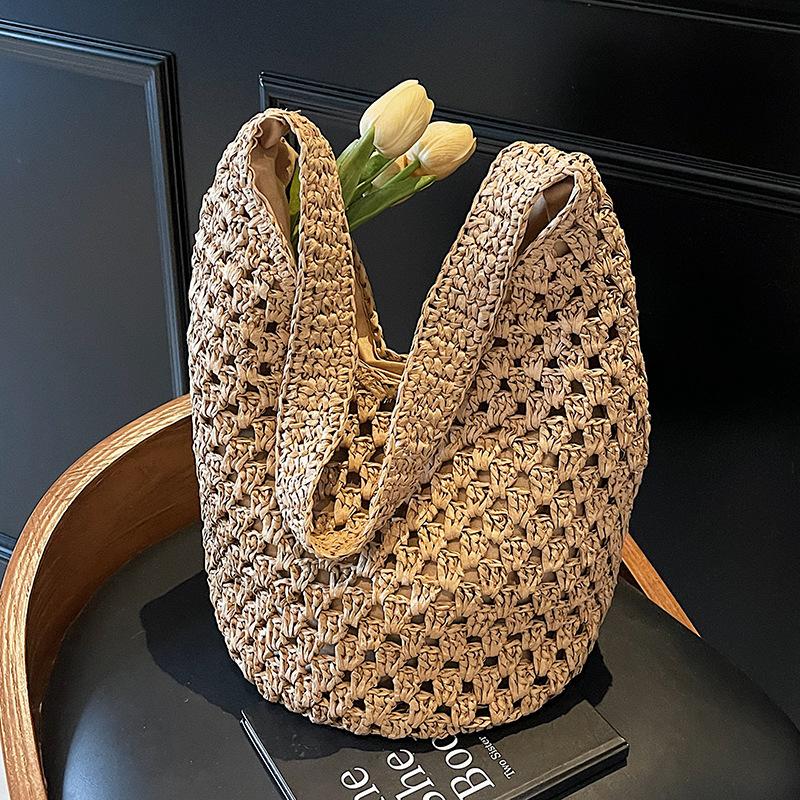 Neue hohle Stroh-Tragetasche Damen Strandurlaubsstil Lässige Schulter-Strandtasche Große Kapazität Stroh gewebte Tragetasche