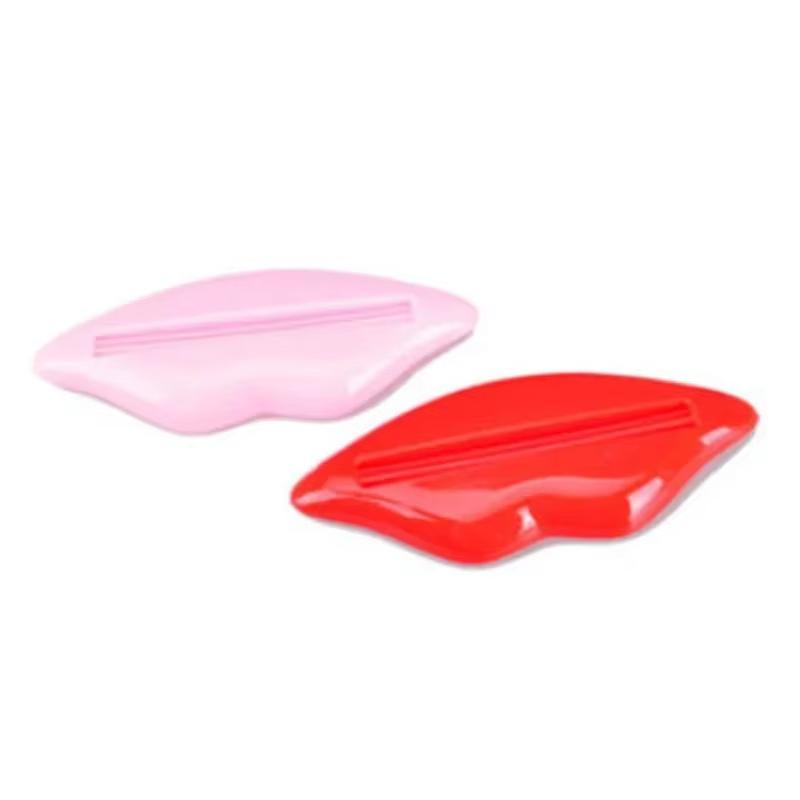 1ks Nejprodávanější Sexy Hot Lip Kiss Koupelnová trubice Dávkovač zubní pasty Krémový odšťavňovač Domácí trubice Rolovací držák odšťavňovač Náhodné barvy